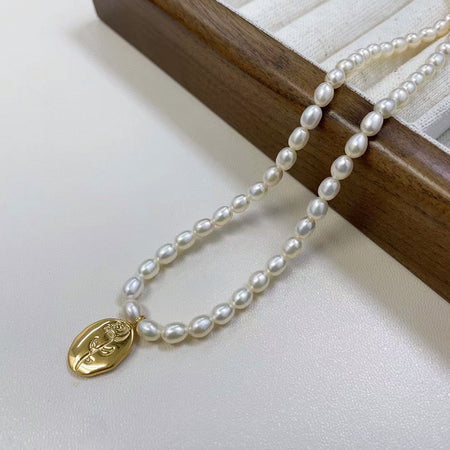 Baroque pearl necklace with flower 18k gold